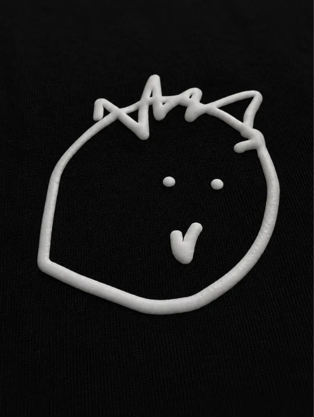 A doodled face printed on the chest
